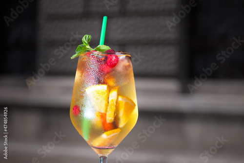 Cold and fresh white sangria in tall wine glass 