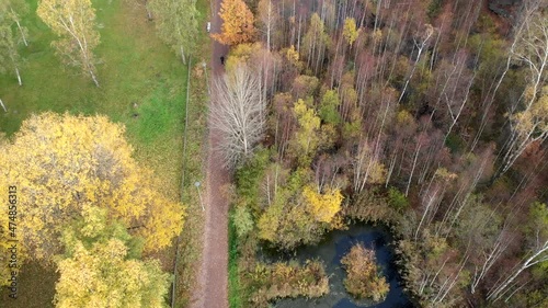 Aerial top dow view Beautiful lake at public park, vibrant autumn colors, Gärdsås mosse, Gothenburg photo