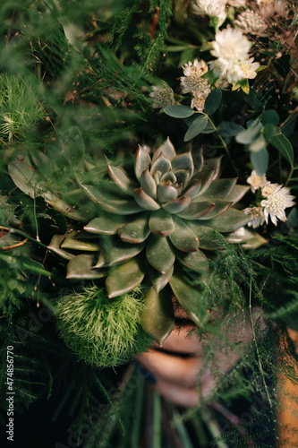Succulents and moss in the installation of wedding decor