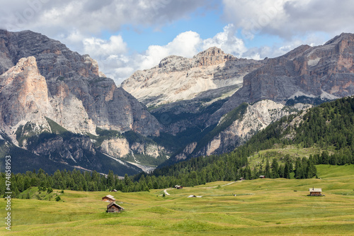 A picturesque valley in the Italian Alps between majestic Dolomite mountains