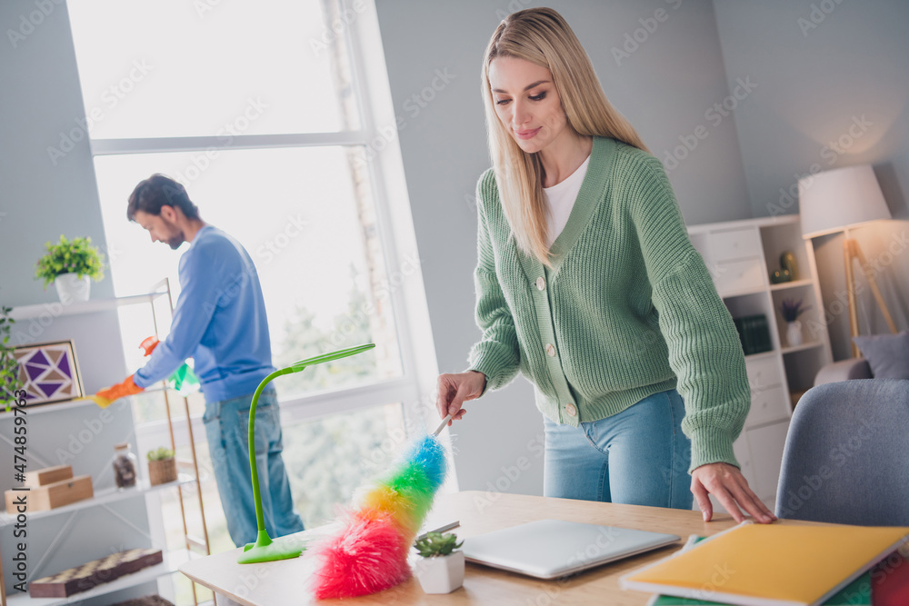 Portrait of two attractive careful people workers making cleanup cleanliness service order at home indoors