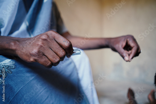 Male person hand hold razor blade