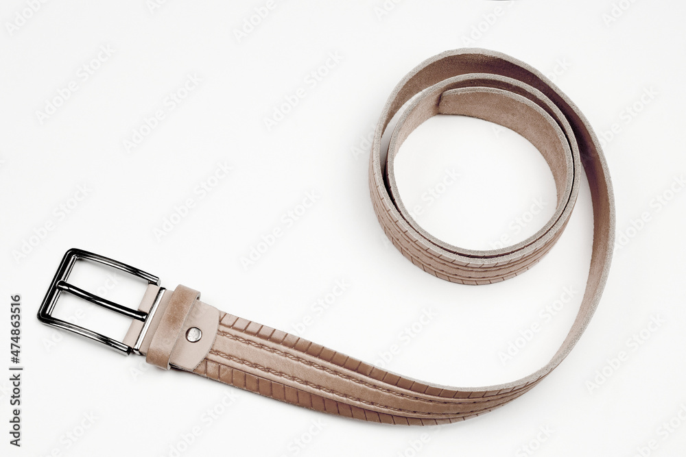 Men's belt on a white background. Male accessory. Men's belt on a white background. Male accessory.