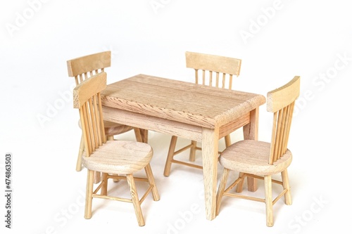 wooden dining table set with chairs on white background