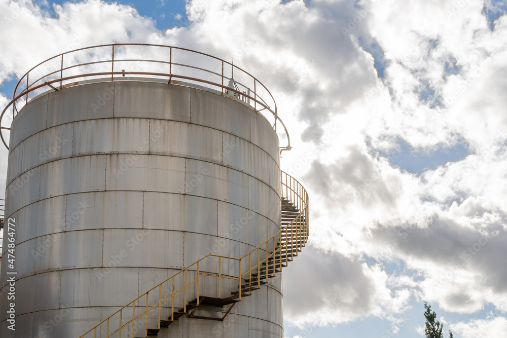 Industrial metal fuel tanks on a sunny day