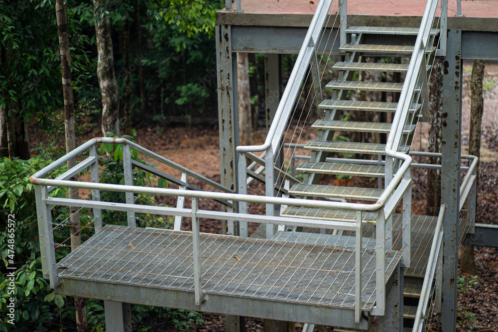 Side view of a steel stairs located outside of a building. Selective focus points
