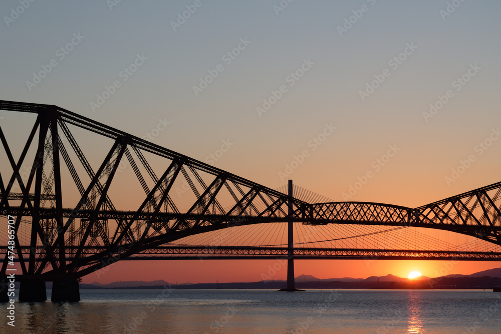 Sun setting behind Forth Rail and Road Bridges Sun setting behind Forth Rail and Road Bridges