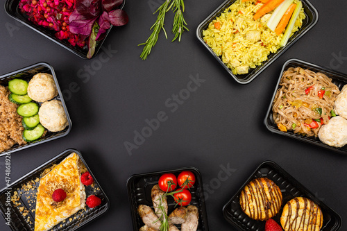 Obraz na plátně Ready healthy food catering menu in lunch boxes meat and vegetable packages on b