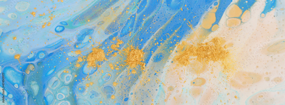 art photography of abstract marbleized effect background with blue, white and gold creative colors. Beautiful paint.