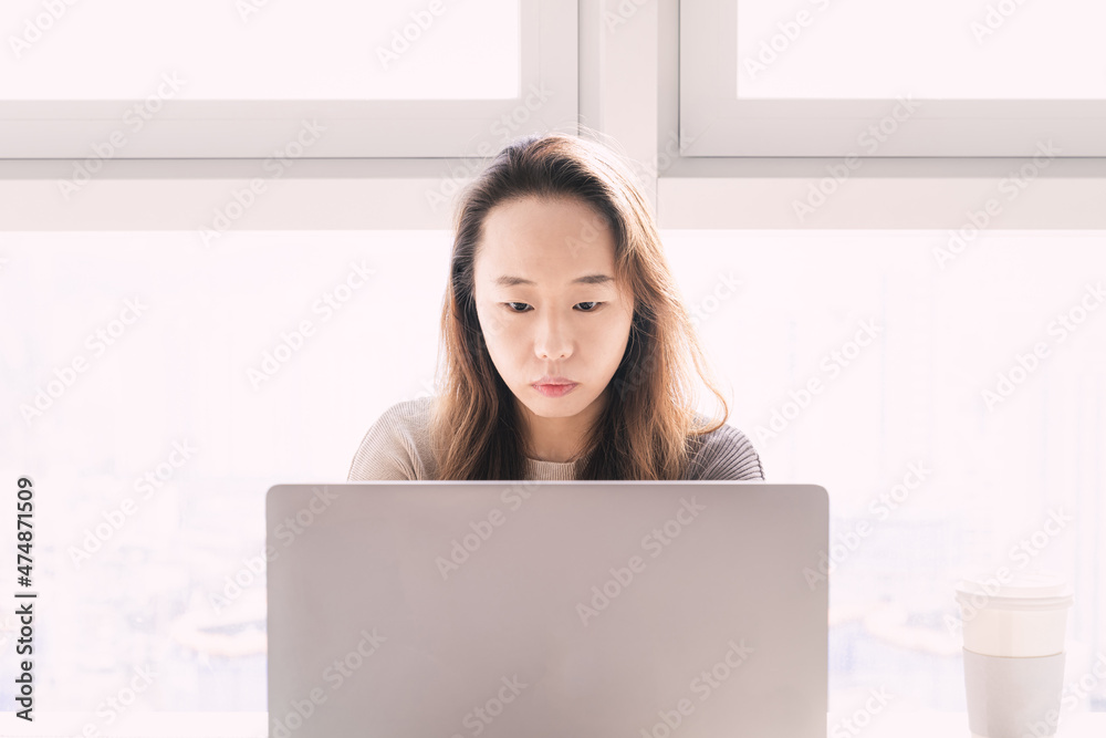 A woman who is working from home due to COVID-19. A woman who is working from home due to COVID-19.