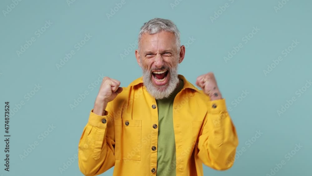 Fun elderly gray-haired bearded man 50s wears yellow shirt countdown 1 2 3 one two three go celebrate win scream do winner hands gesture isolated on plain pastel light blue background studio portrait Fun elderly gray-haired bearded man 50s wears yellow shirt countdown 1 2 3 one two three go celebrate win scream do winner hands gesture isolated on plain pastel light blue background studio portrait