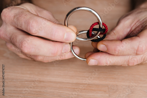 Metal puzzle for fine motor skills and development - prevention of illness in the elderly - two rings and ropes must be separated