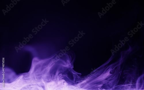 Abstract purple smoke moves on black background. Beautiful swirling violet smoke. Neon light.