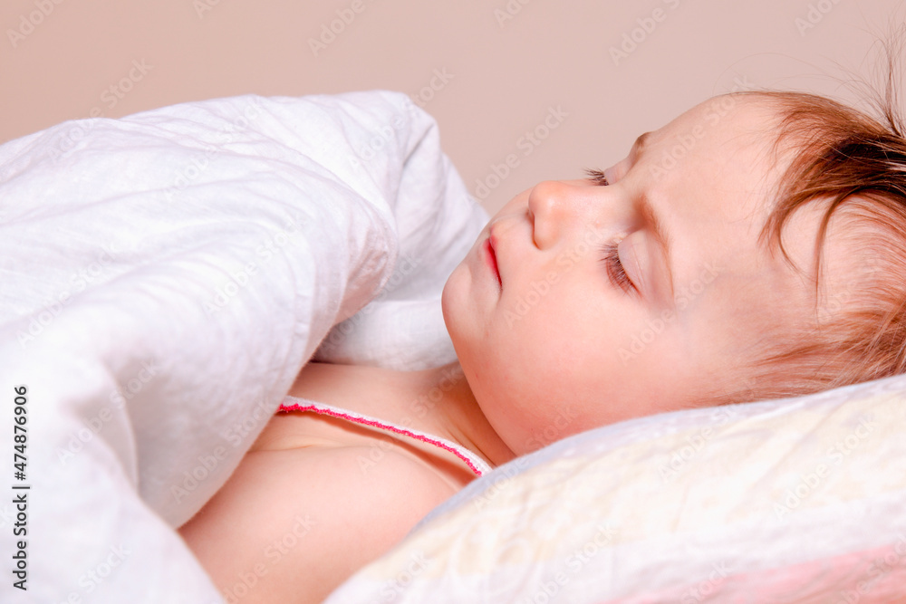 Carefree sleep and children's happy dreams. Portrait of adorable cute baby girl sleeping on king bed. Carefree sleep and children's happy dreams. Portrait of adorable cute baby girl sleeping on king bed.