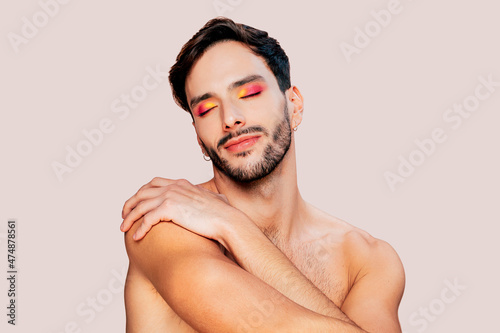 Obraz na plátně Portrait of gay man with beard, pink and yellow eyeshadow, eyes closed, no clothes