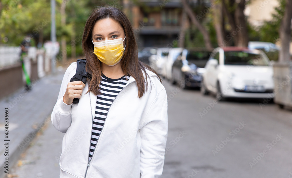 Fototapeta premium Young woman in medical face protection mask.