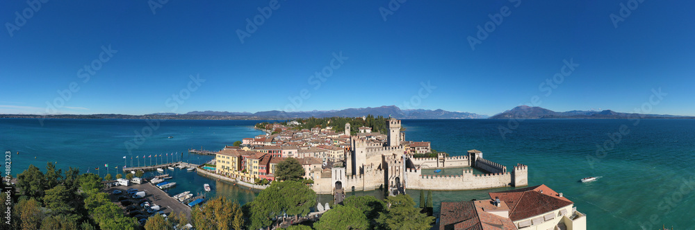 Sirmione aerial view. Autumn in Sirmione. Top view, historic center of the Sirmione peninsula, lake garda. Lake Garda, Sirmione, Italy. Aerial panorama of Sirmione.