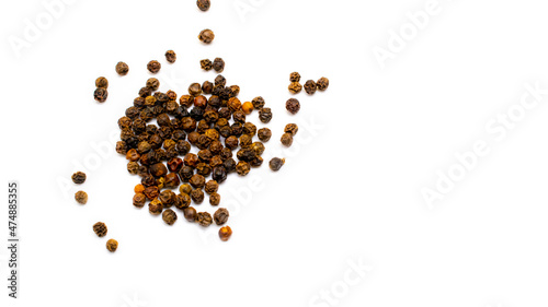 black peppercorns on a white background