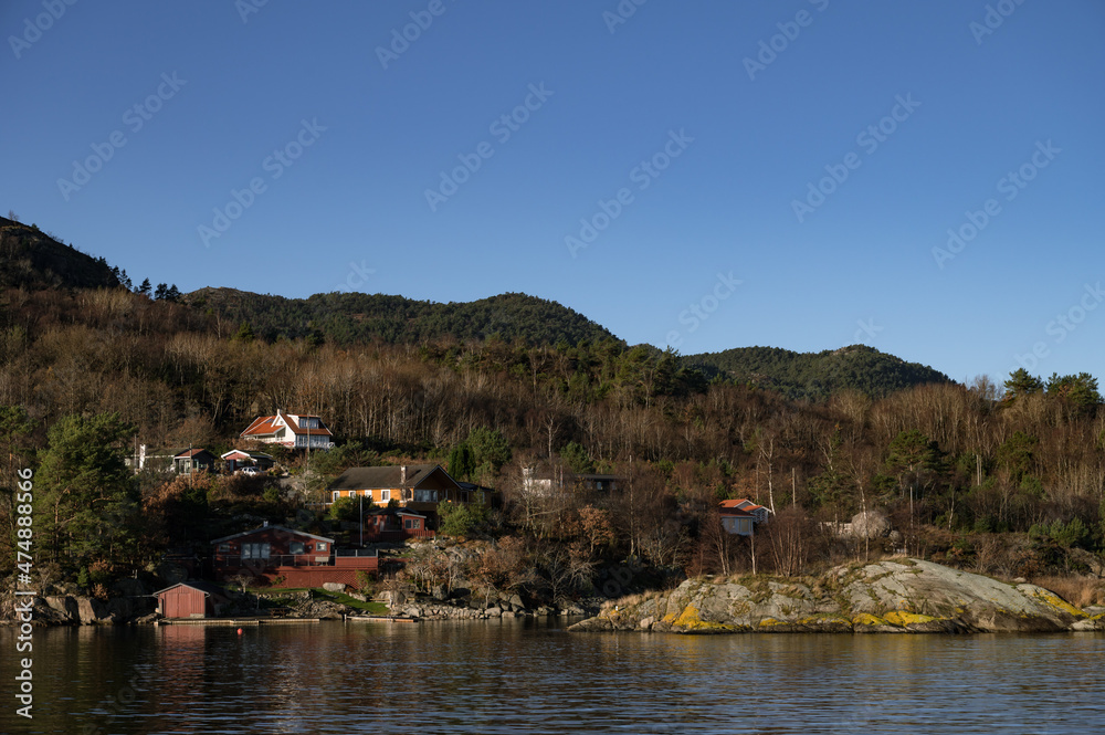 Landscape of hilly area of island in Lusefjord. Beautiful nature on sunny day.