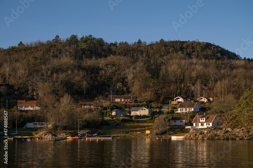 Landscape of hilly area of island in Lusefjord. Beautiful nature on sunny day. © Anastasia