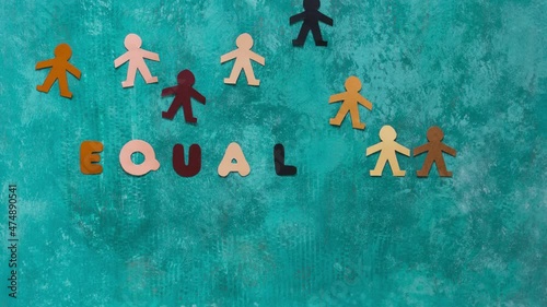 Anti-racism stop motion with some multi-ethnic paper dolls moving until it appears the word EQUALITY photo