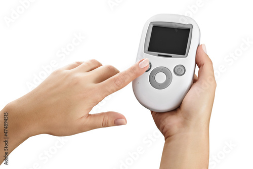 Wallpaper Mural Female hand holding a simple baby monitor, while pressing a button, isolated
 Torontodigital.ca