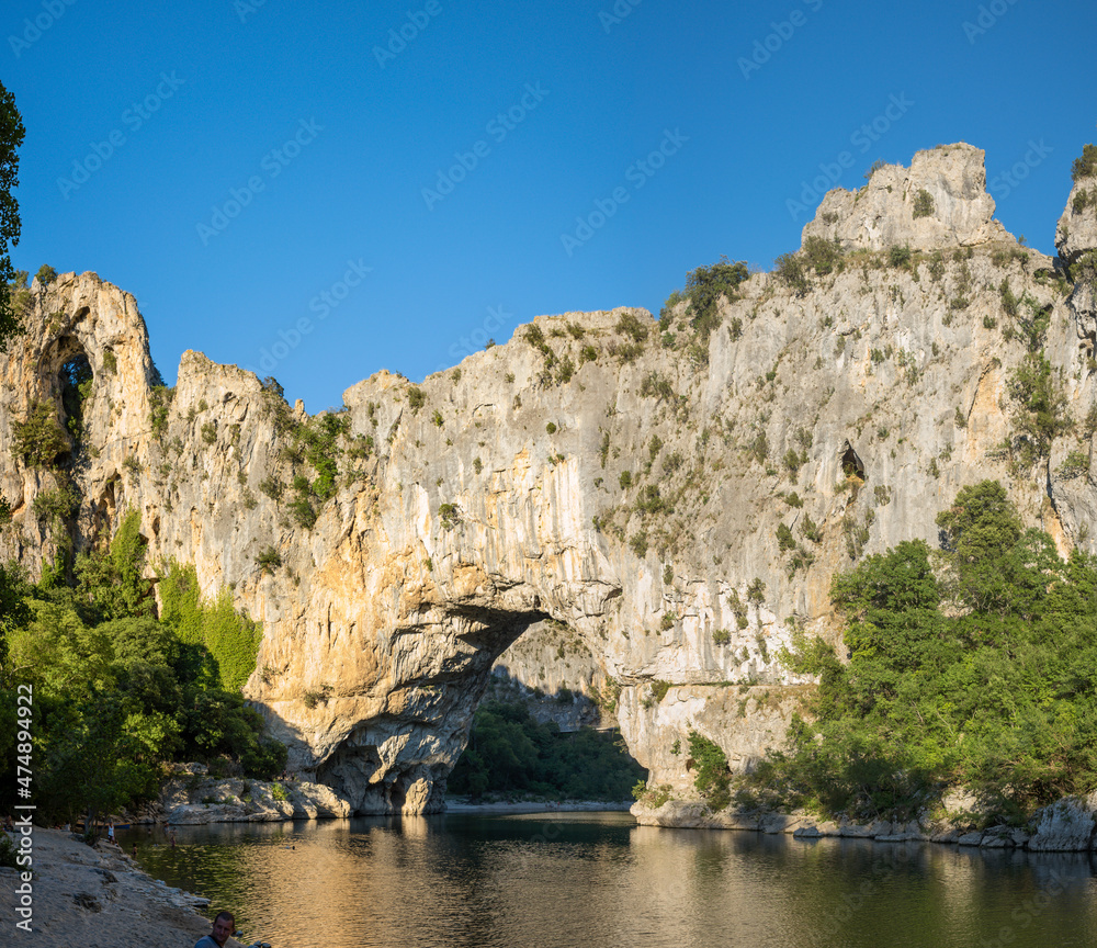 The panoramic view of the Pont dArc in the Ardeche gorges in Europe, France, Ardeche, in summer, on a sunny day.