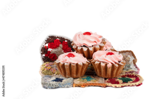 Beautiful sweets. Cakes basket with pink cream decorated with red berries.