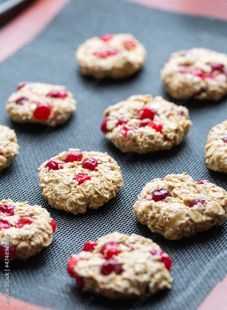 The process of making dietary oatmeal cookies with banana and cranberries. Vegan food The process of making dietary oatmeal cookies with banana and cranberries. Vegan food