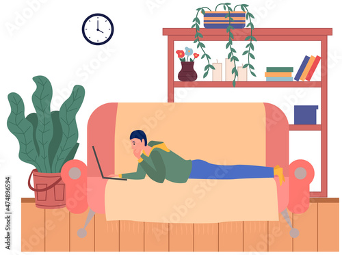 Distance learning, freelance and internet job. Man lying with laptop on couch at home. Remote work, online home freelancing, entertainment. Online communication, internet surfing in living room