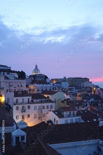 Cityscape Image of Lisbon, Portugal during dramatic sunrise.