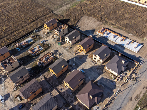 einforced concrete house foundation, poured concrete floor and brick walls. photo