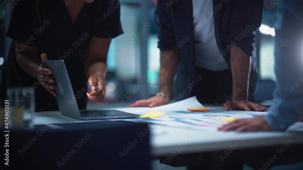 Office Conference Room Meeting in Close Up: Focusing on Hands on Table: Diverse Team of Top Managers Talk, Discuss, Brainstorm, Use Laptop Computer. Business Partners Negotiating Marketing Strategy.