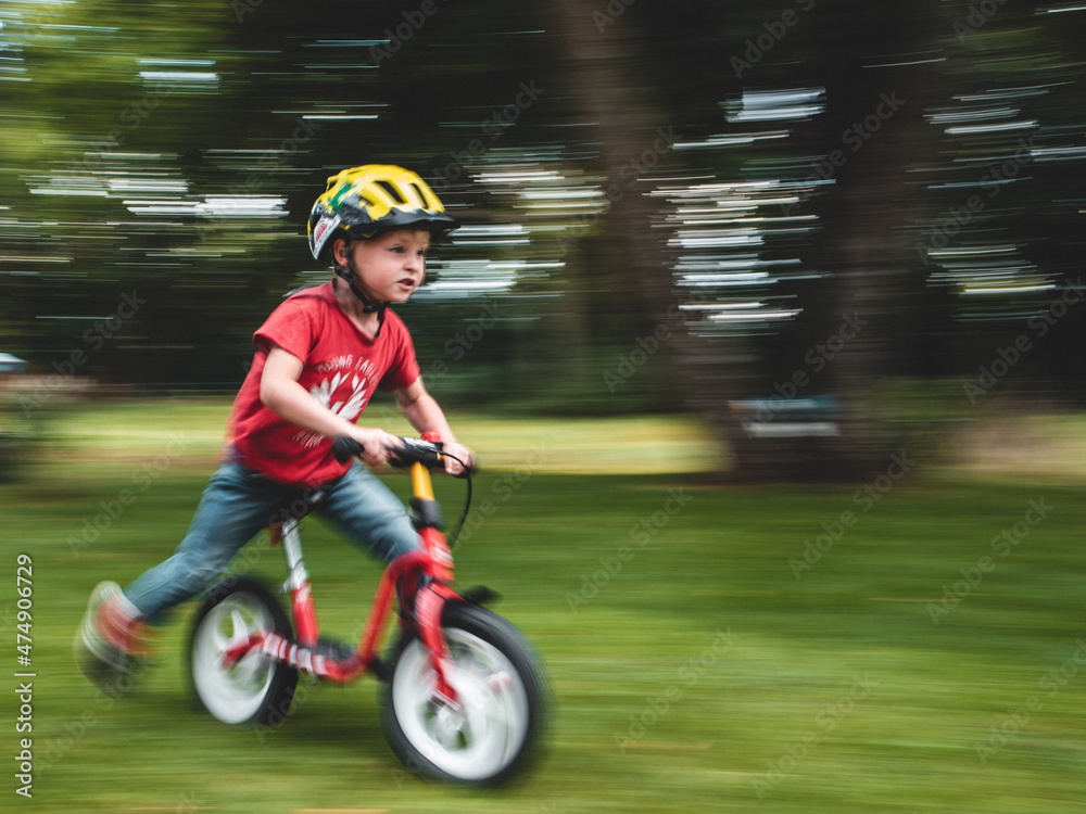 child riding a bike fast I