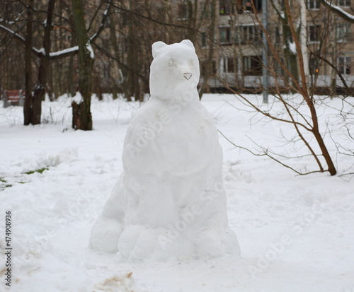 A snow figure in the courtyard of a residential building