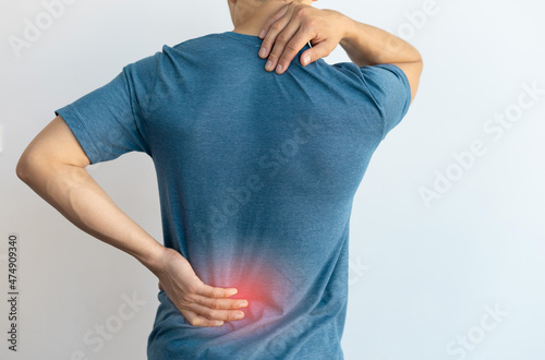 Man with back pain and lumbar pain. photo