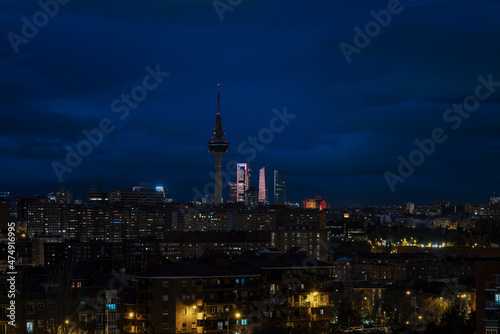 Panorama of city of Madrid, Spain, at night, with high tower buildings on background