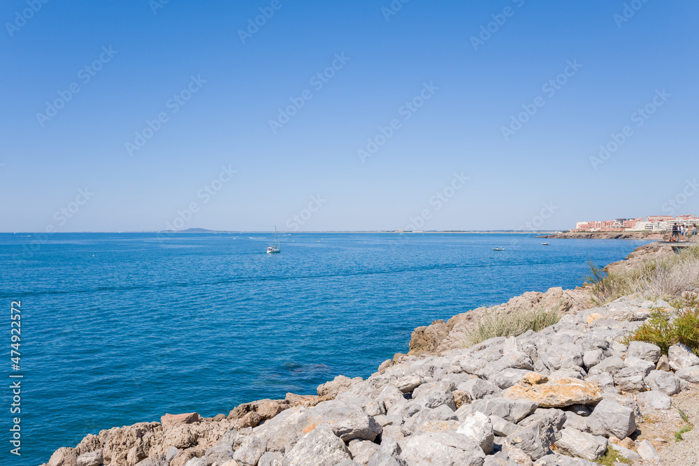 The edge of the Mediterranean sea of ​​the city of Setes in Europe, in France, in Occitanie, in the Herault, in summer, on a sunny day.