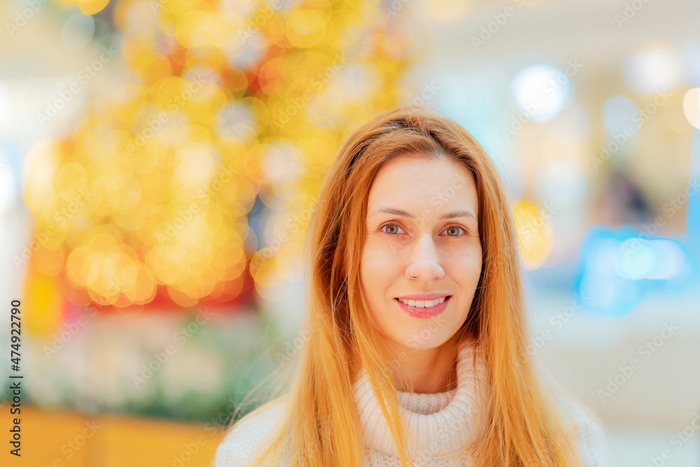 Portrait of fair-haired smiling woman on defocused background with bokeh Portrait of fair-haired smiling woman on defocused background with bokeh