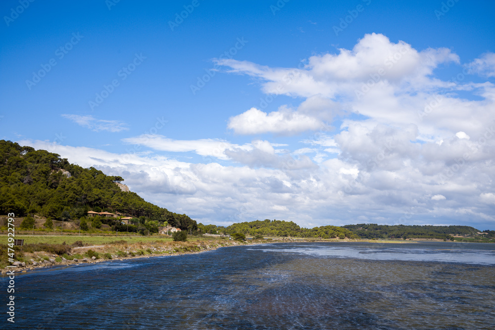 The pond of Gruissan and its banks in Europe, France, Occitanie, Herault, in summer, on a sunny day.