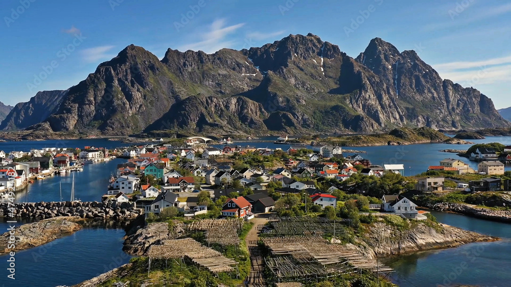 Amazing nature of Lofoten Islands, Norway By Drone top view  surrounded by norway sea green traditional district in the county of Nordland breathtaking scandinavian soccer mountain rock architecture