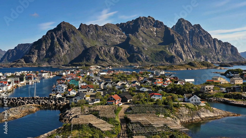 Amazing nature of Lofoten Islands, Norway By Drone top view  surrounded by norway sea green traditional district in the county of Nordland breathtaking scandinavian soccer mountain rock architecture © Yerassyl