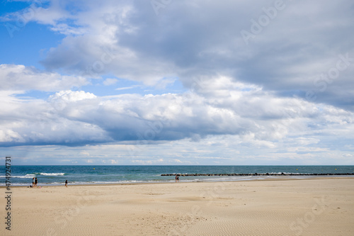The fine sand beach of the city of Agde in Europe, France, Occitanie, Herault, in summer, on a sunny day. © Florent