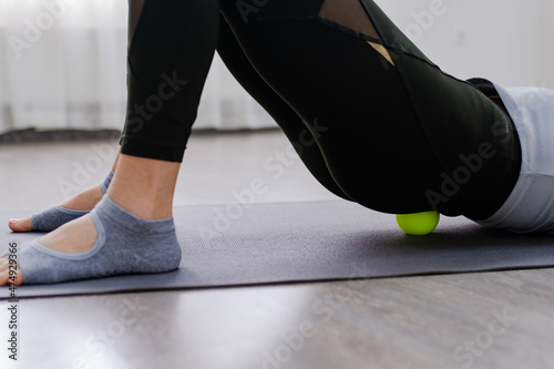 Close up Woman use Myofascial release massage balls on lower back