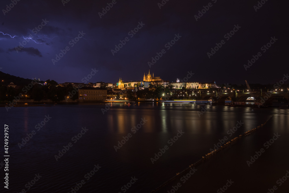 Night view of Prague Castle and Charles Bridge during a rainstorm - Prague, Czech Republic