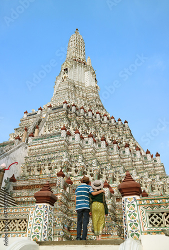 Couple Climbing Up to Phraprang, the Central Spire of Wat Arun or The Temple of Dawn, One of the Iconic Landmarks of Bangkok, Thailand photo