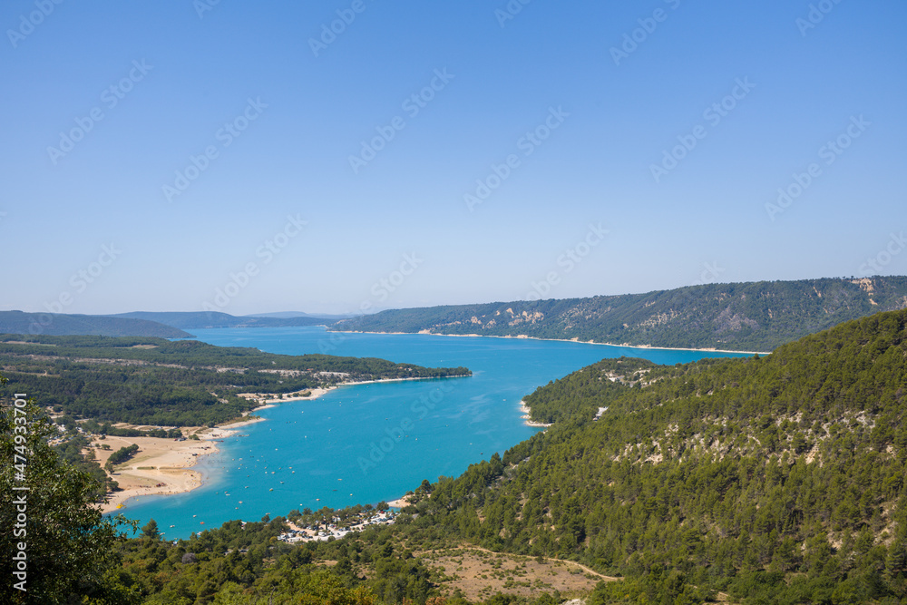 The panoramic view of the Lac de Sainte-Croix and its green countryside in Europe, France, Provence Alpes Cote dAzur, Var in the summer on a sunny day.