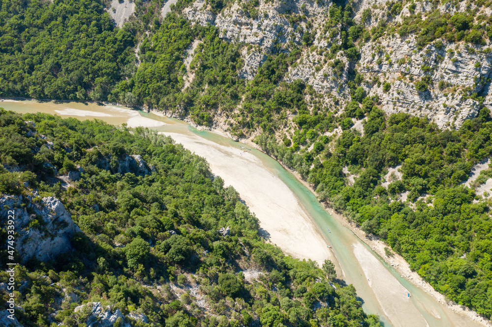 The Verdon river flows through the mountains and forests in Europe, France, Provence Alpes Cote dAzur, Var, in the summer on a sunny day.