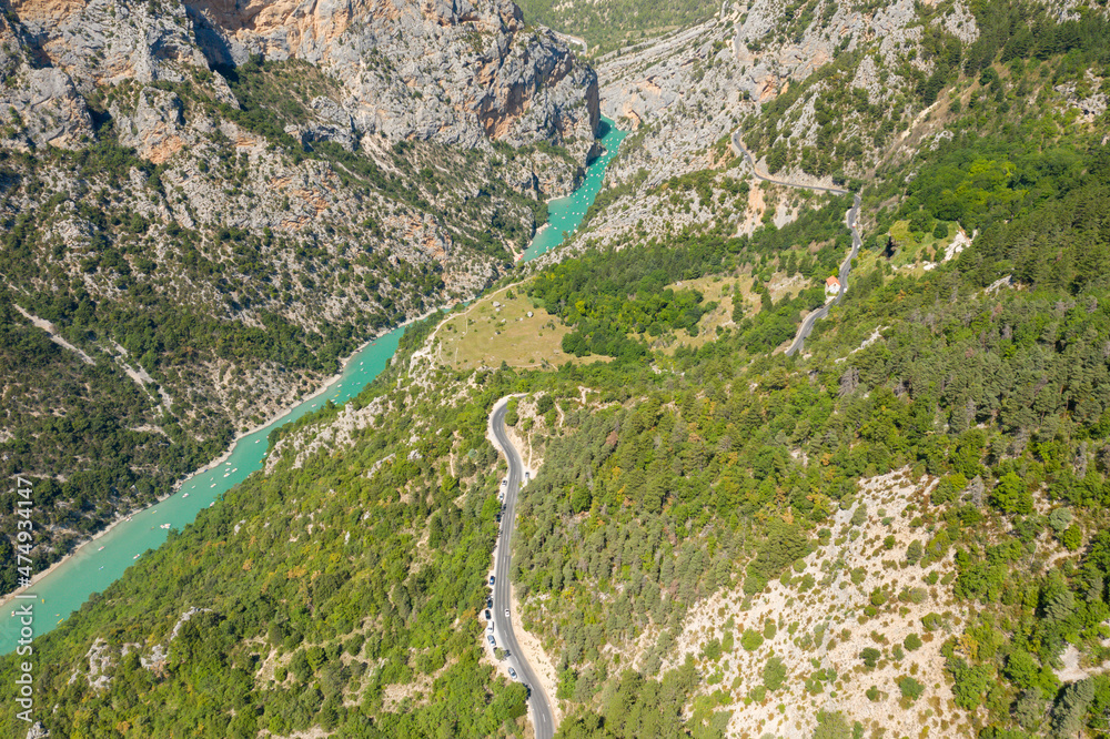 Fototapeta premium A road parallel to the Verdon river surrounded by gorges and mountains in Europe, France, Provence Alpes Cote dAzur, Var, in summer, on a sunny day.