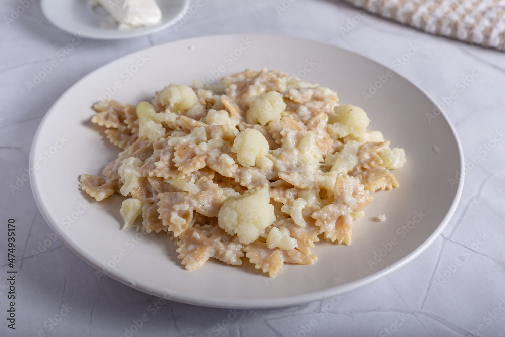 Pasta with cauliflower and goat cheese.